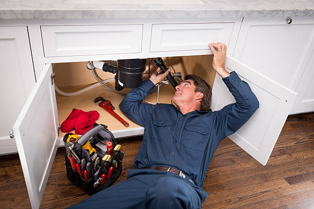 Plumbers fixing guest bathroom issues